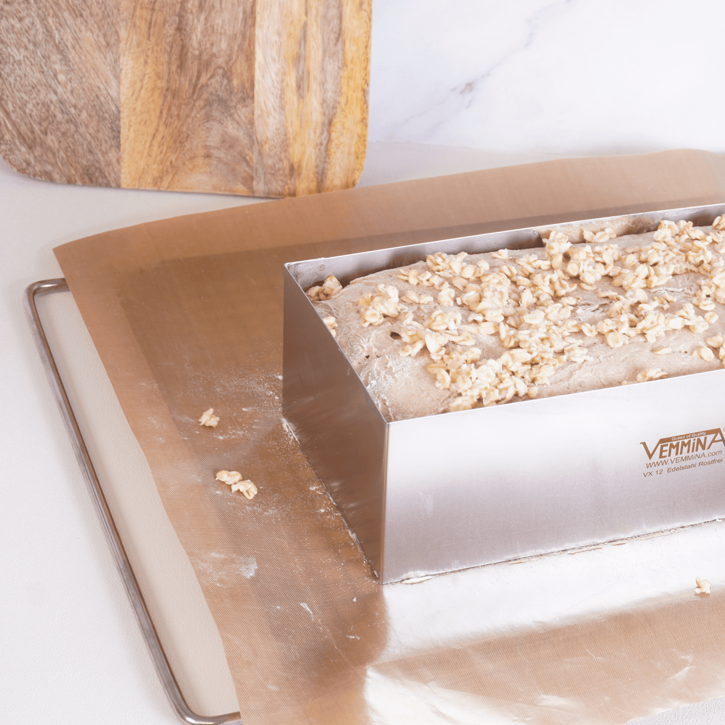 Brot-Profi baking mold with dough topped with nuts, showcasing easy and reliable baking solutions.