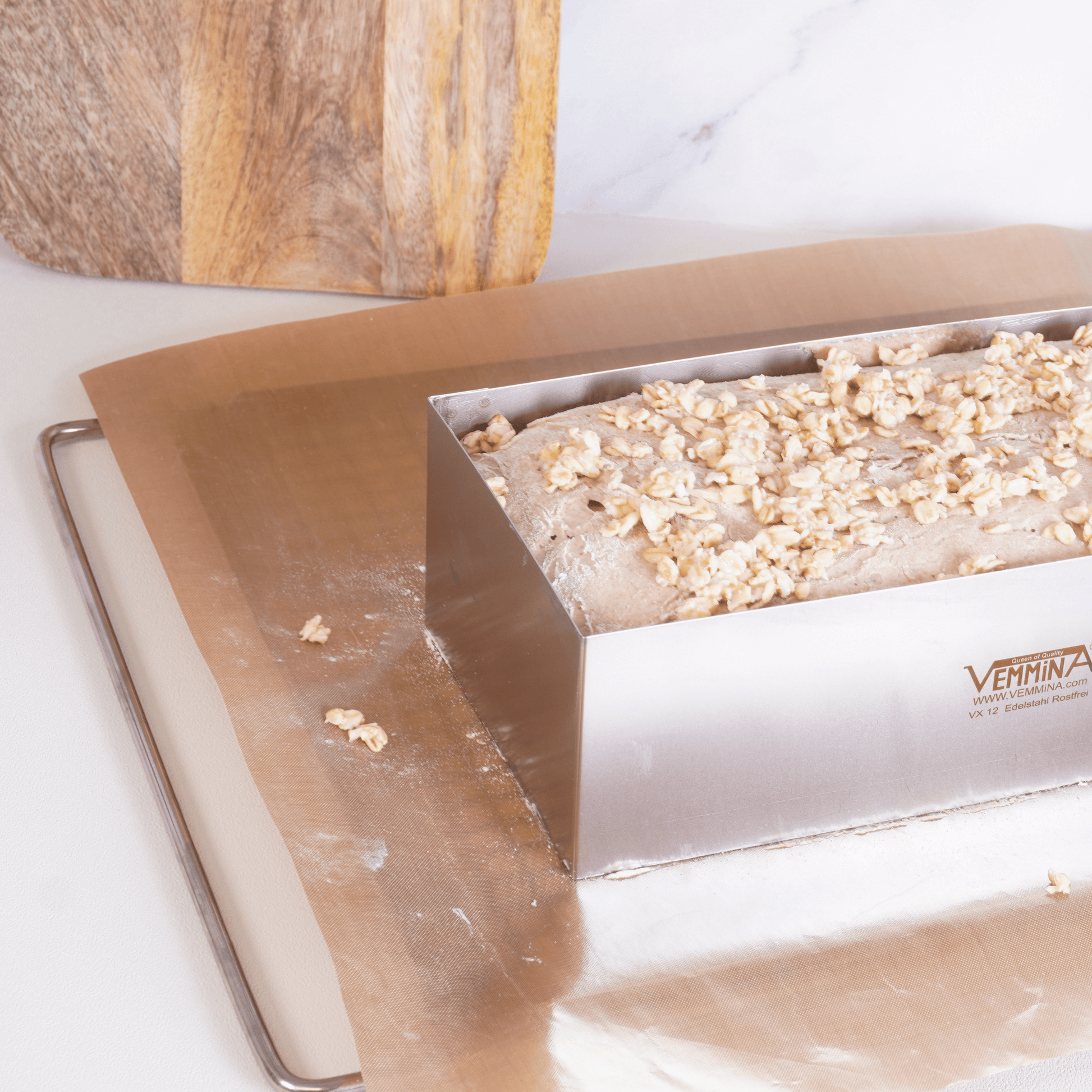 Brot-Profi baking mold with dough topped with nuts, showcasing easy and reliable baking solutions.